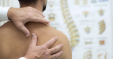 Do I Have a Rotator Cuff Tear? Do I Need Surgery? Picture of a young caucasian male having his shoulder checked.