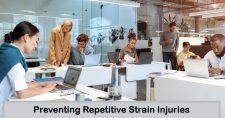 Preventing Repetitive Strain Injuries at Your Desk. Picture of 4 males and 3 females, of varied ethnicities sitting at office desks.