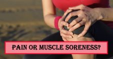 Is It Pain or Muscle Soreness? Picture of a caucasian female holding on to her knee as in pain.