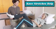 Knee Stretches for Arthritis Pain. Picture of an older caucasian female lying down while a young caucasian female physical therapist works on stretches on the leg.