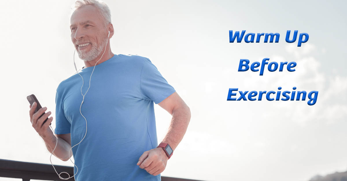 Warm Up Before Exercise. Picture of a caucasian male jogging or power-walking while listening to music with earbuds.