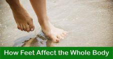 Understanding How Feet Affect the Body. Picture of a caucasian female's feet in the sand.
